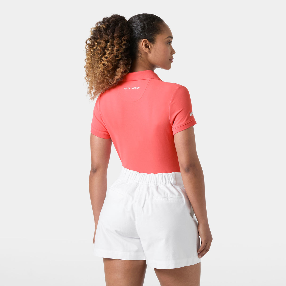 Explore Helly Hansen Women Crewline Quick-Dry Polo - Sunset Pink for trail, outdoor & lifestyle use | Liv Activ Singapore