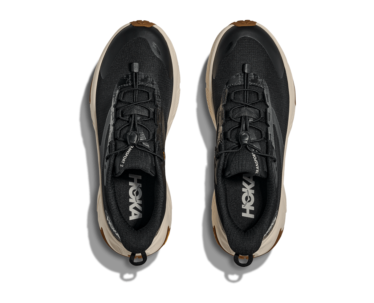 Explore HOKA Women Transport 2 Wide - Black / Alabaster for trail, outdoor & lifestyle use | Liv Activ Singapore