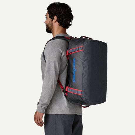 Explore Patagonia Black Hole® Duffel Bag 40L - Smolder Blue with Amanita Red for trail, outdoor & lifestyle use | Liv Activ Singapore