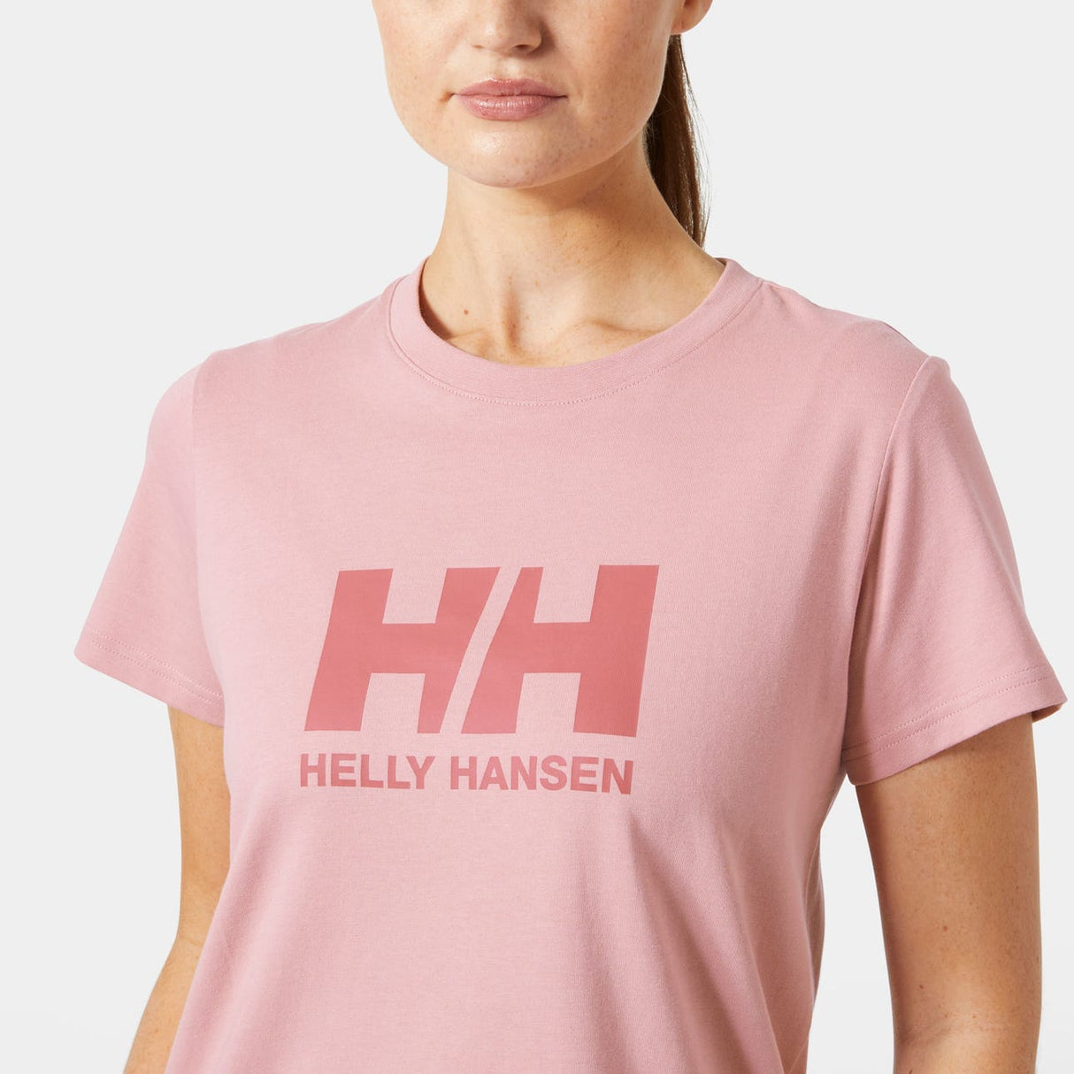Explore Helly Hansen Women HH Logo T-shirt 3.0 - Pink Salt for trail, outdoor & lifestyle use | Liv Activ Singapore
